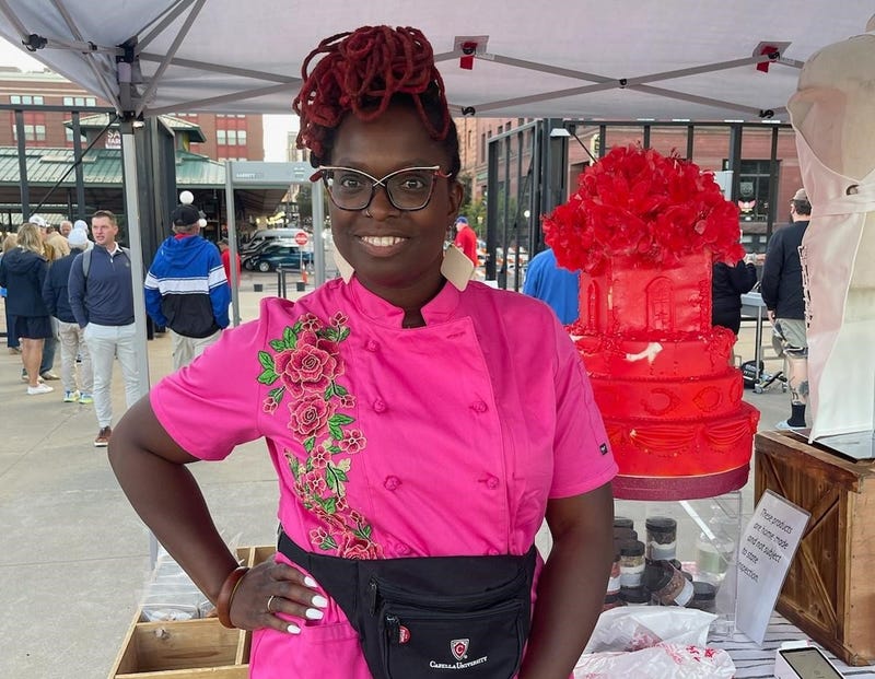 Sheletta Brundidge throws out first pitch at St Paul Saints game to mark Black Business Night at the Ballpark