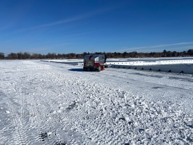 Getting the ice ready for the Pond Hockey Championships on Lake Nokomis on Tuesday.