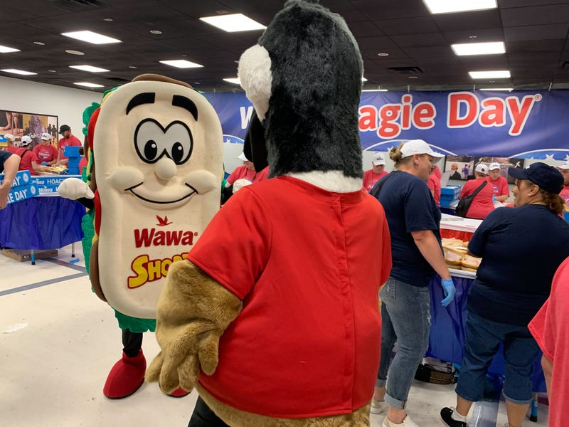 Wally the goose greets Shorti for a long day of sandwich-making.