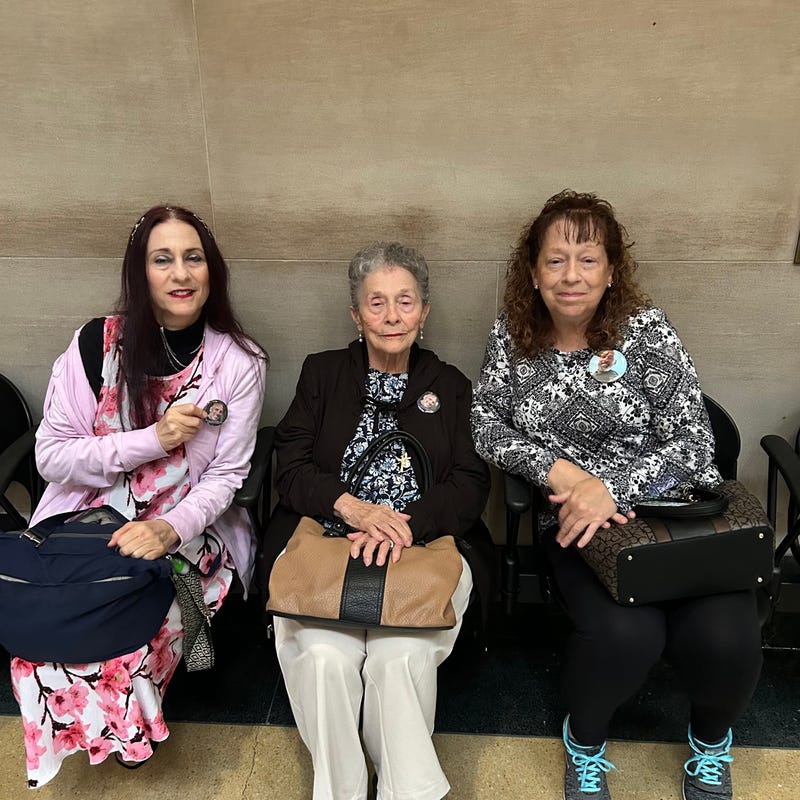 DeVito’s family showed up in court wearing buttons with his image on them