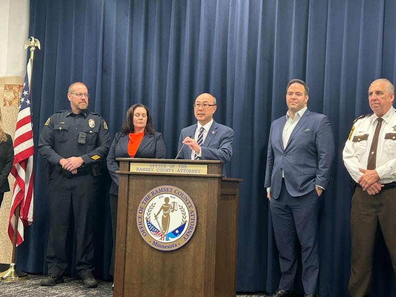 Ramsey County Attorney John Choi (at microphone), Ramsey County Sheriff Bob Fletcher (far right) and others announce new protocols in Ramsey County to get guns out of the hands of at-risk suspects.
