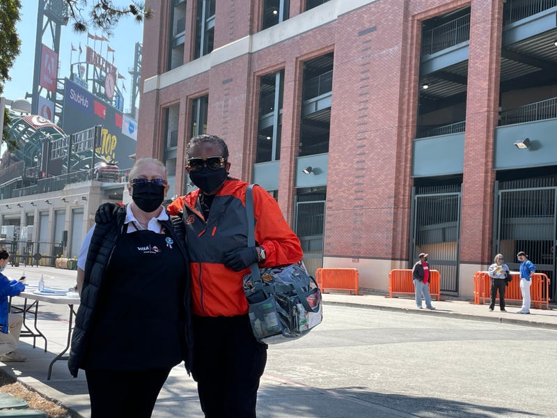 Two Oracle Park food service workers celebrate their new agreement with Bon Appetit, the Giants food service contractor.