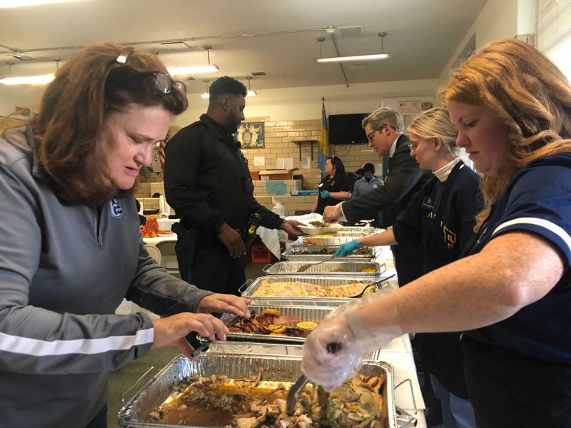 Officers getting food from La Salle University students