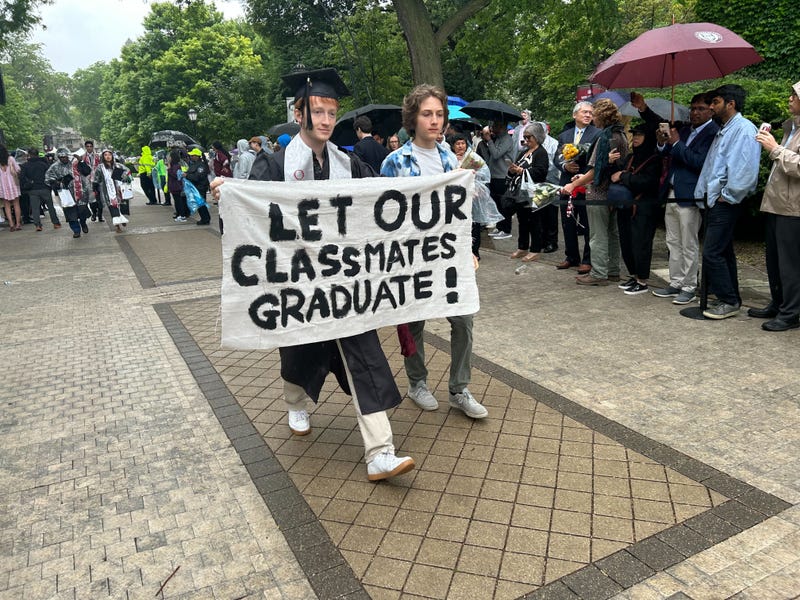 students walk out of graduation ceremony