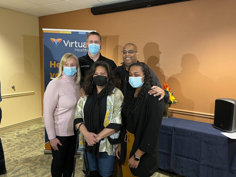 Ken Hogan posing with people who saved his life