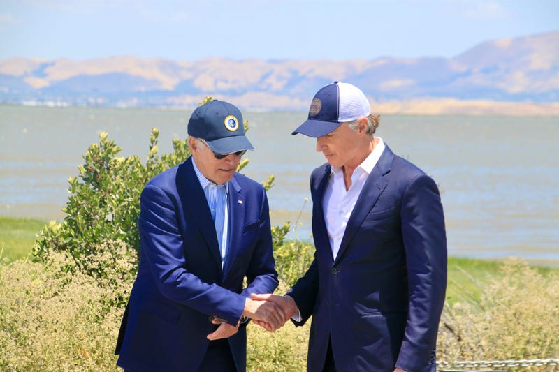 President Joe Biden (L) and California Gov. Gavin Newsom shaking hands in Palo Alto while discussing new federal funding to fight climate change on Monday, June 19, 2023.