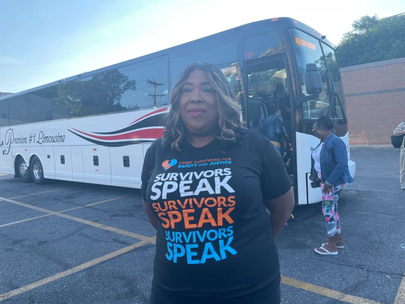 Yolanda Jennings, Philadelphia chapter coordinator of Crime Survivors for Safety and Justice, stands in front of a charter bus headed for Harrisburg Tuesday morning to urge lawmakers to take action against violent crimes.
