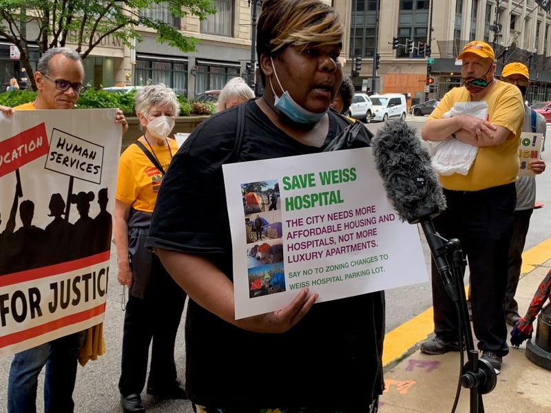 Uptown residents, including the homeless, were outside City Hall on Thursday morning, protesting plans for a luxury high-rise near Weiss Memorial Hospital.