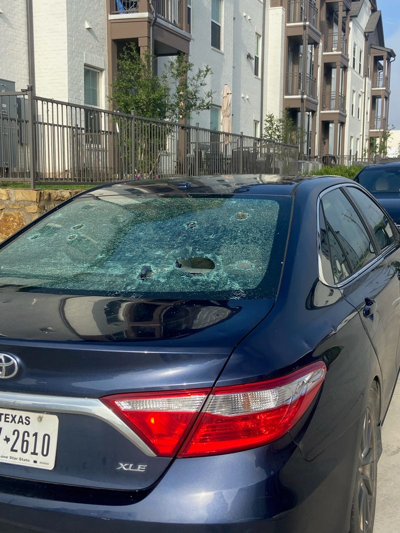 Car with shattered windows from Sunday's hail storm