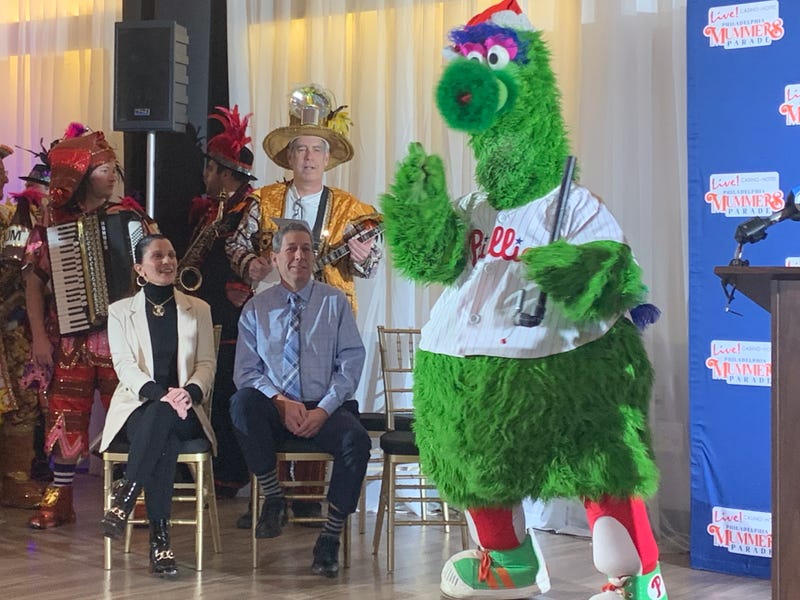 The Phillie Phanatic (right) helps the Mummers announce their plans for the 2024 edition of the iconic parade.