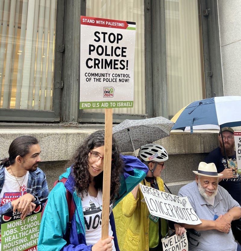 DNC protester marches outside City Hall