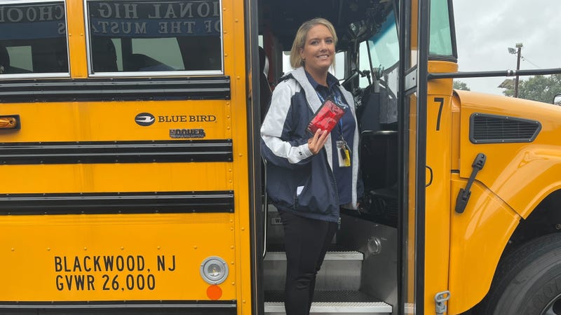 Black Horse Pike Regional School District bus driver Stacy Kendall in the doorway of a school bus.