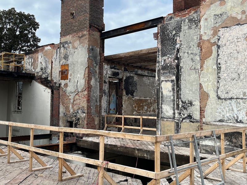 Burnt out bricks and wood plank floors