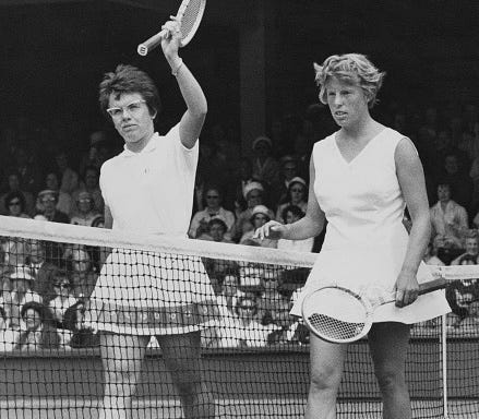 Billie Jean Moffitt of the United States holds her tennis racquet aloft to acknowledge the crowd after losing to Ann Haydon of Great Britain in their Women's Singles Quarterfinal