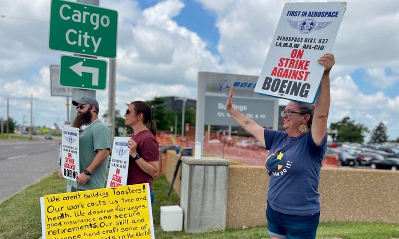 Assembly mechanic Christy Williams strikes outside of her employer, Boeing aerospace company, in Berkeley, Mo. She joined 3,200 other union members of the International Association of Machinists and Aerospace Workers who went on strike at midnight on Aug. 4 to get better wages and retirement plans.