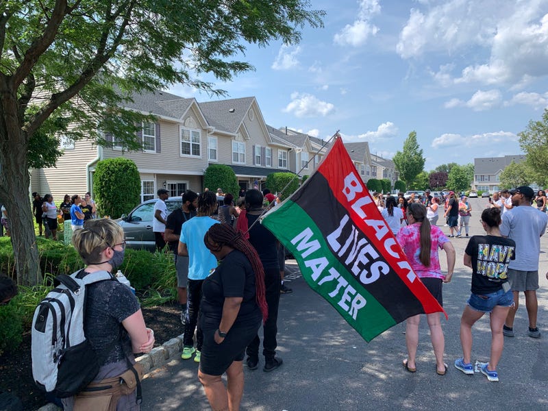 A protest outside the home of a Mount Laurel man who was arrested and charged with race-based harassment and intimidation.