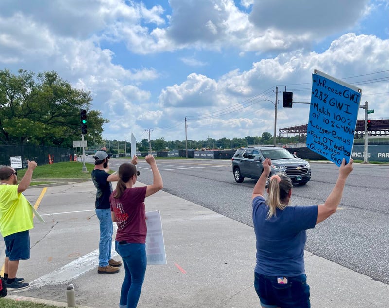 Boeing employees hold strike line on Aug. 5 outside of company facility in Berkeley, Mo.