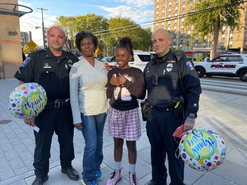 From left: Officer Justin Busam, Kamille Young, Aamanee Young, and Officer Christopher DeRose.