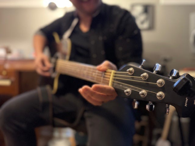 Alan plays guitar.