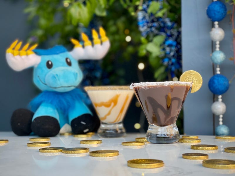 The pop-up features wall-to-wall Hanukkah décor, a bar serving up themed food and drink, a shot-ski Menorah, Instagram-worthy photo-ops, tons of lights a whole lot of chocolate gelt, and much, much more!