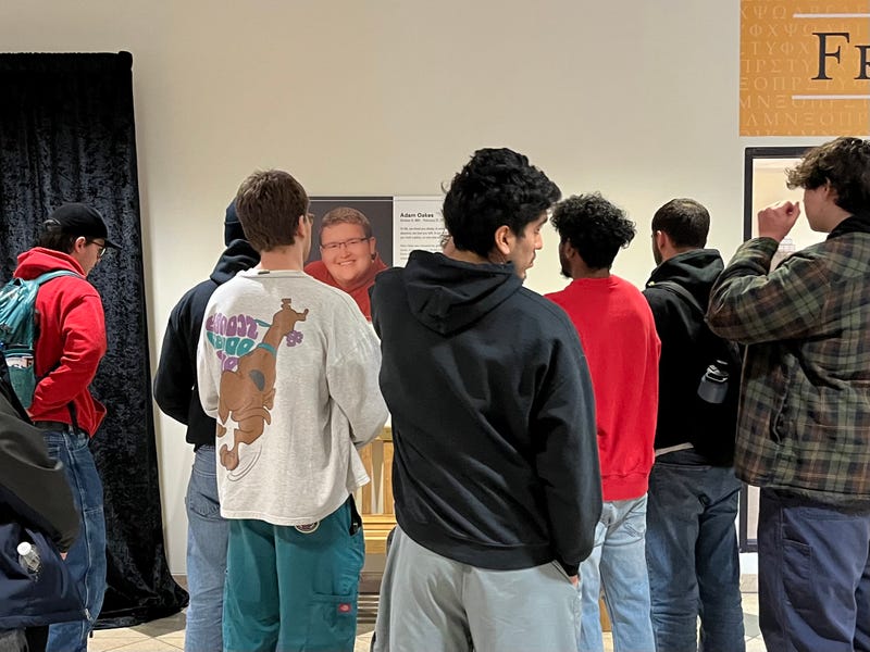 VCU students stand in front of Oakes' commemorative plaque