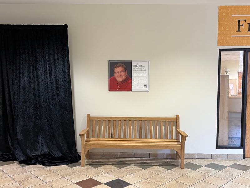 The bench and plaque unveiled in Oakes' honor