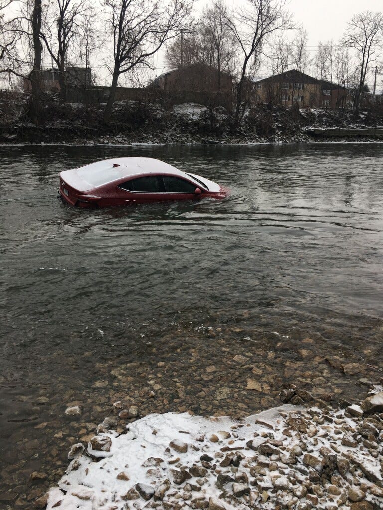 A car and a body were found a short distance away from each other Sunday in the Des Plaines River in the western suburbs.