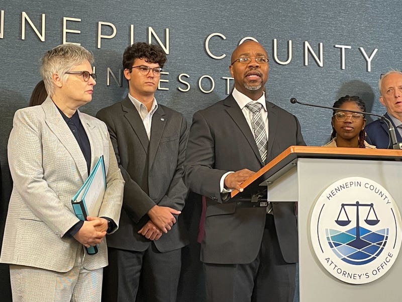 Hennepin County Mary Moriarty (L) and Jerome Nunn (Center) speaking Wednesday in downtown Minneapolis.