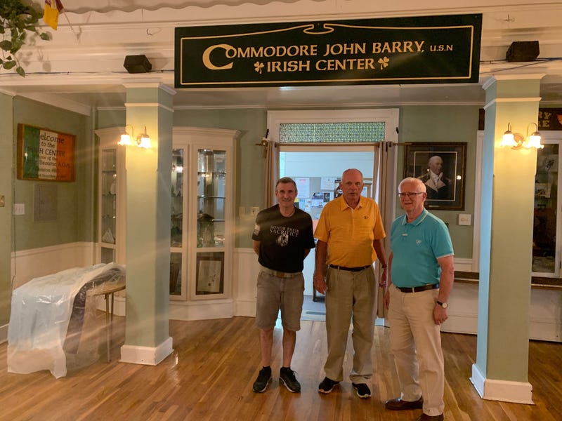 From left: Member Tommy Kennan, manager John Nolan and club President Sean McMenamin in the entryway to the Irish Center.