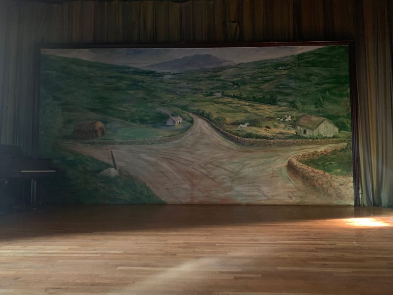 A mural in the ballroom depicting an Irish crossroads.