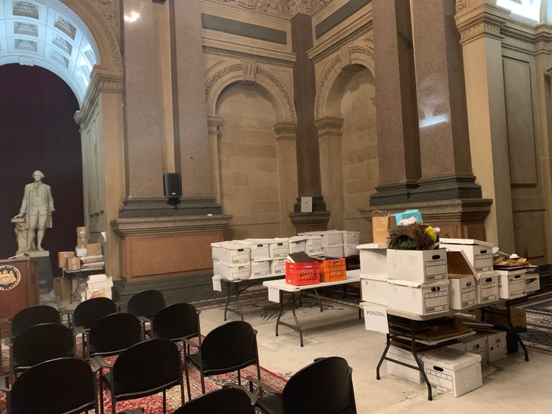 Boxes from the mayor's office are stacked temporarily in Conversation Hall.