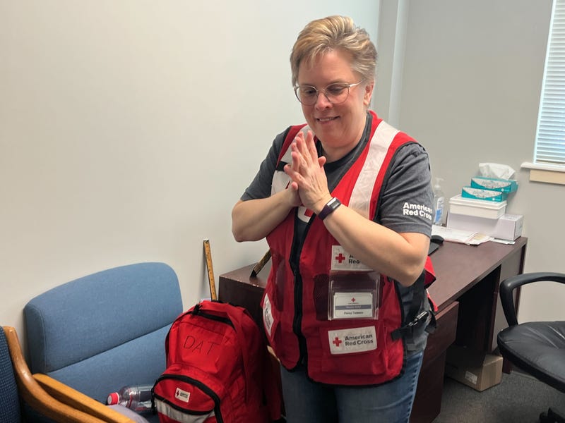 Penny Tedesco from Maple Shade, New Jersey, checks in to Red Cross Center in Pennsauken before heading to Philadelphia International to fly to LAX.