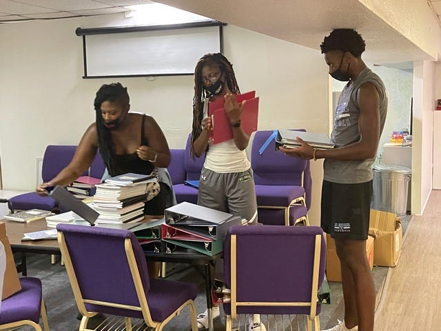 GBUL Executive Operations Manager Tershea Ewell & her kids stuffing book bags with Giant for GBUL's Back to School Drive last year 