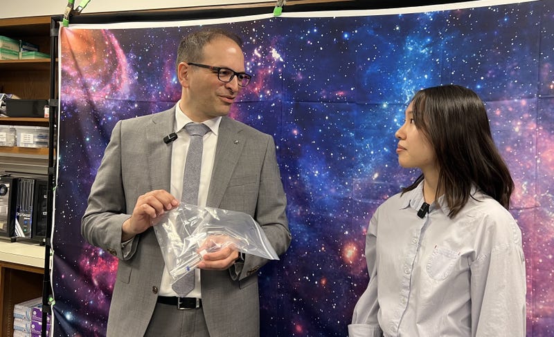 Field Museum Curator for Meteoritics and Polar Studies and University of Chicago resident graduate student Yuke Zheng present a sample of the rare asteroid Bennu
