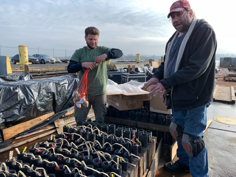 Pyrotecnico workers at the Navy Yard preparing fireworks for New Year's shows.