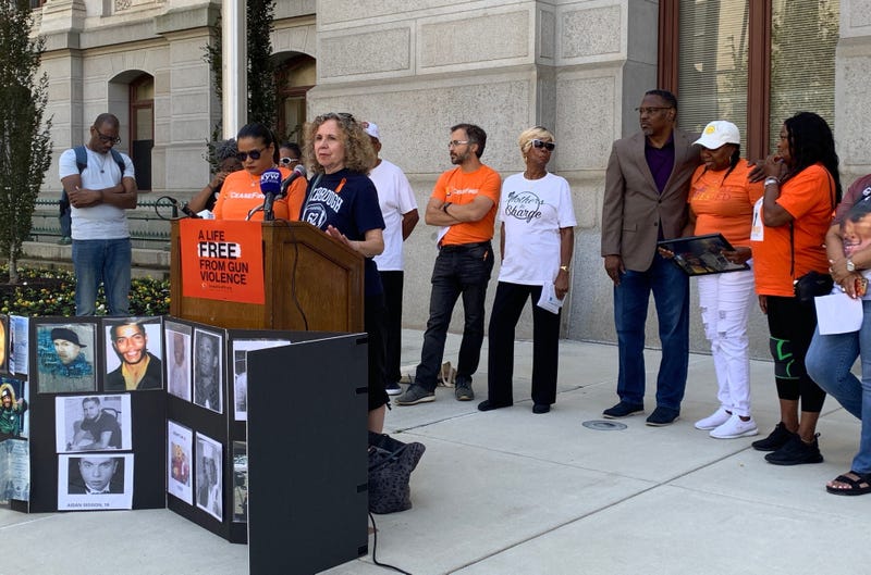 Marge LaRue (at podium), grandmother of 14-year-old Nicolas Elizalde, who was shot and killed in 2022, speaks on Sept. 12, 2023 at a rally ahead of a hearing the following day where Philadelphia argued against the state's preemption law before the Pa. Supreme Court.