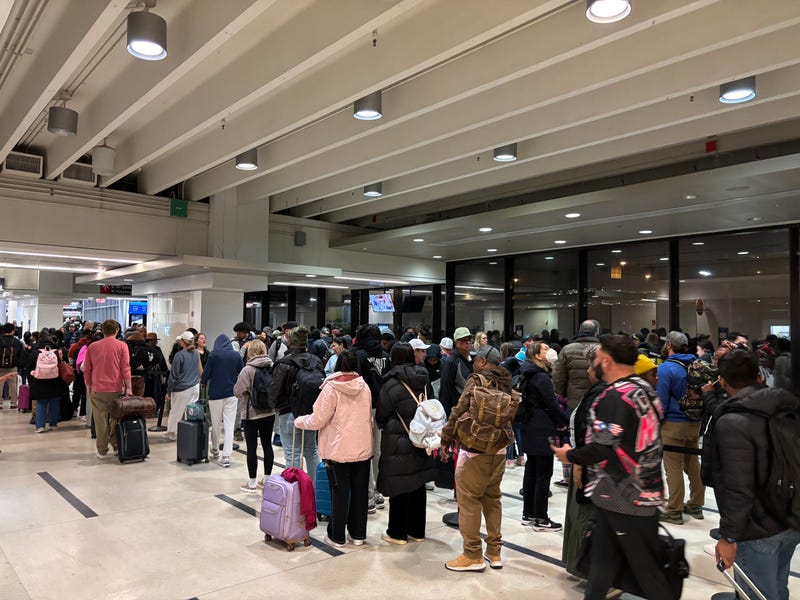 Travelers at Philadelphia International Airport on Nov. 27, 2024, the day before Thanksgiving.