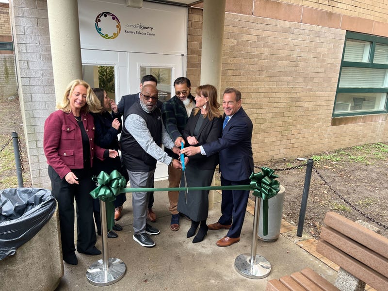 Officials cut the ribbon in front of the new re-entry facility in Camden County.