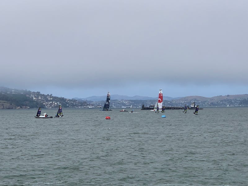 Various sailors practice on their boats for the SailGP competition.