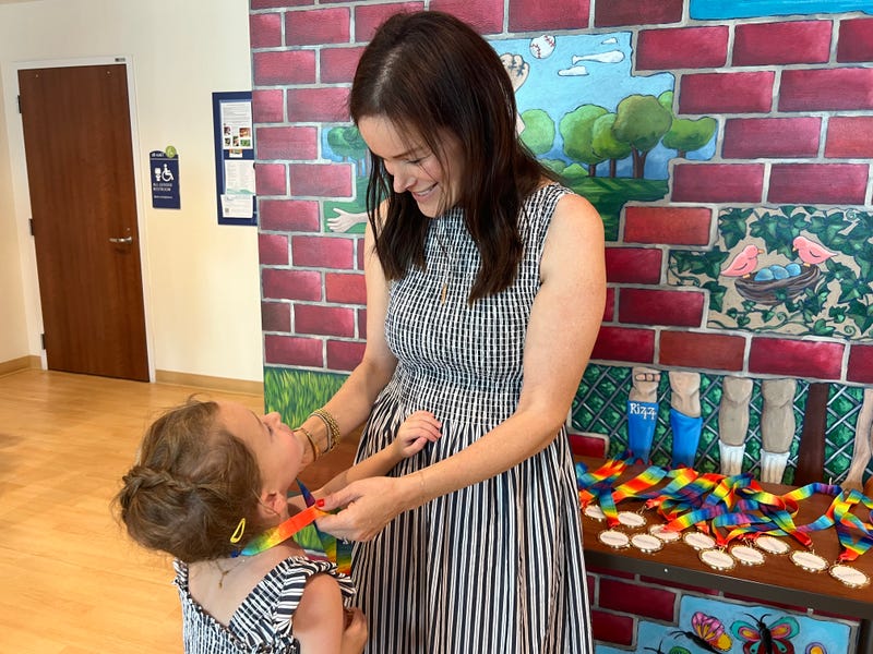 Danielle Moss and her 6-year-old daughter Margot. Moss said the idea to hold a medal ceremony for pediatric cancer patients at Lurie Children's Hospital was Margot's idea.