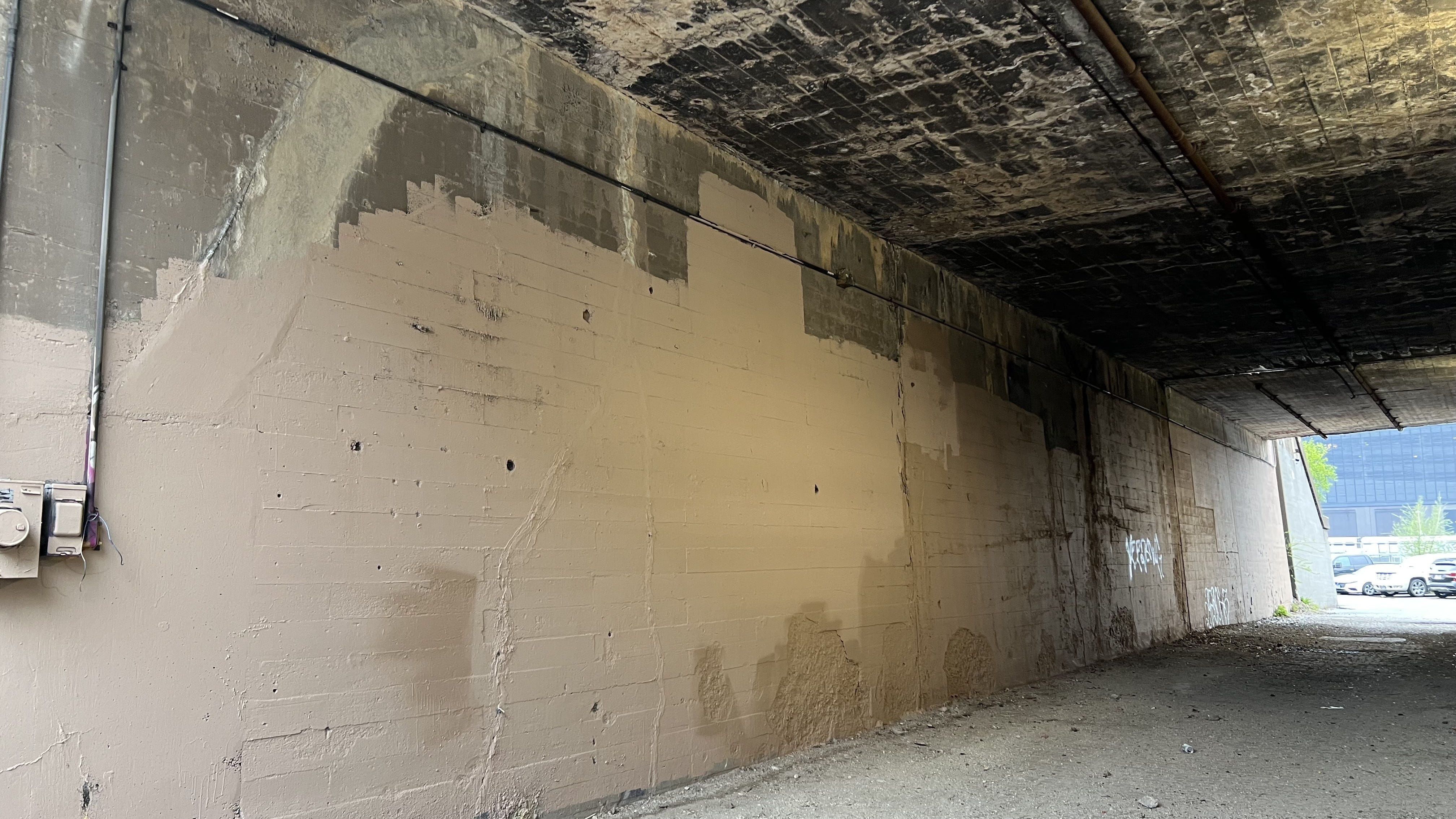 Who painted over West Loop murals honoring late music artists?