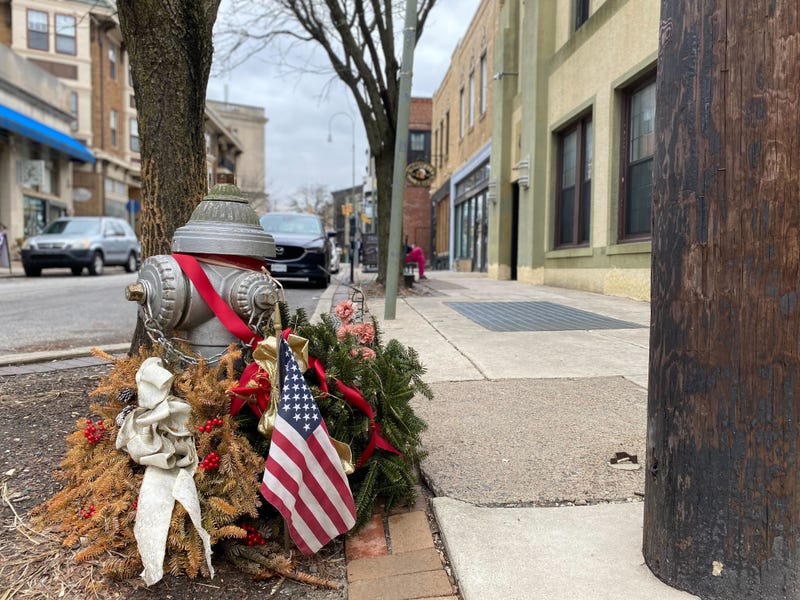 A memorial is set up near the location where 70-year-old Renee DiPietro is accused of murdering 31-year-old Michael Sides.