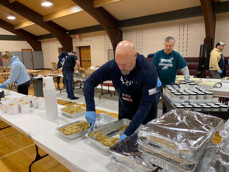 John Clauss, founder of Feeding Everyone at Special Times (FEAST), packs Christmas meals for families in need at St. Robert Bellarmine Church in Warrington, Bucks County, Dec. 23, 2025.