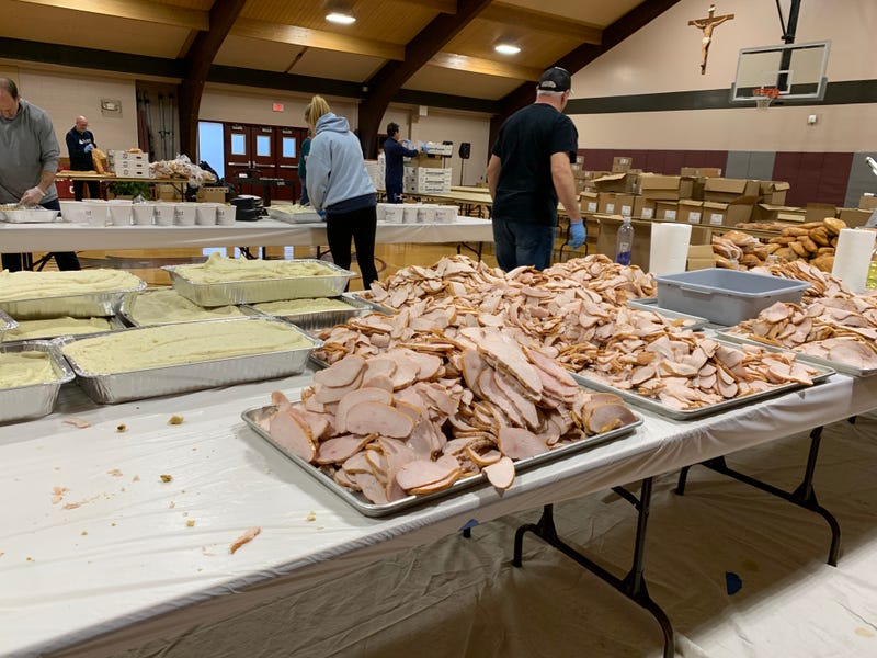 FEAST volunteers pack Christmas meals for families in need at St. Robert Bellarmine Church in Warrington, Bucks County, Dec. 23, 2025.