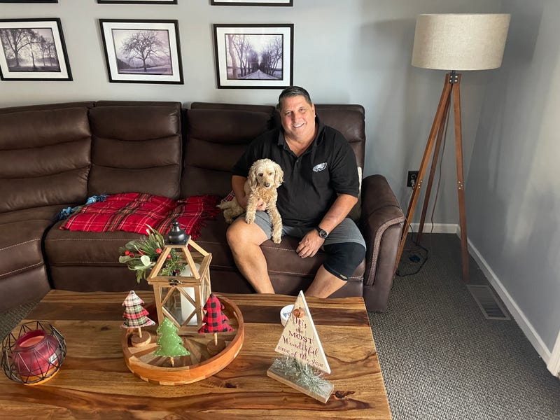 Pat DiCrecchio is shown in his family room, which was turned into a "laundry room" for the commercial.