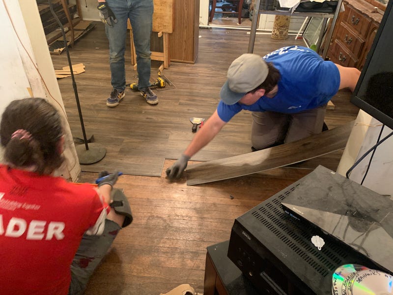 Volunteers putting a floor into Robert Shell’s house in Strawberry Mansion