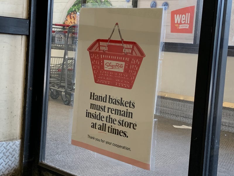 A sign at ShopRite informing customers, "Hand baskets must remain inside the store at all times."