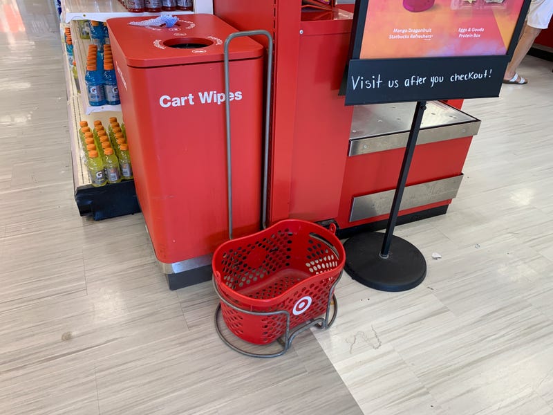 An empty tray of hand baskets in a Target store.