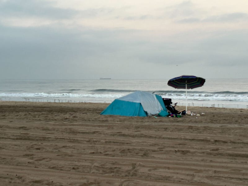 homeless encampment on beach