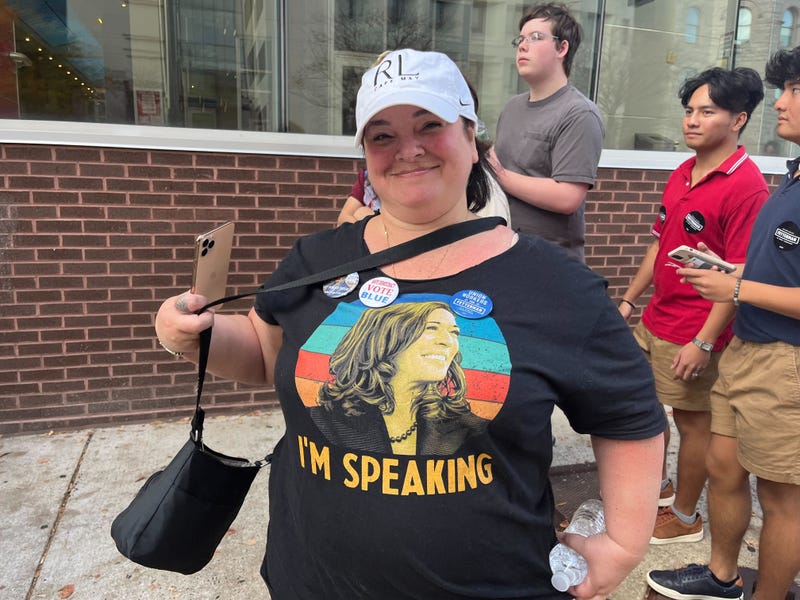 A Democratic Party supporter attending a rally at Temple University's Liacouras Center for U.S. Senate candidate John Fetterman and gubernatorial candidate Josh Shapiro, with both President Joe Biden and former President Barack Obama appearing.
